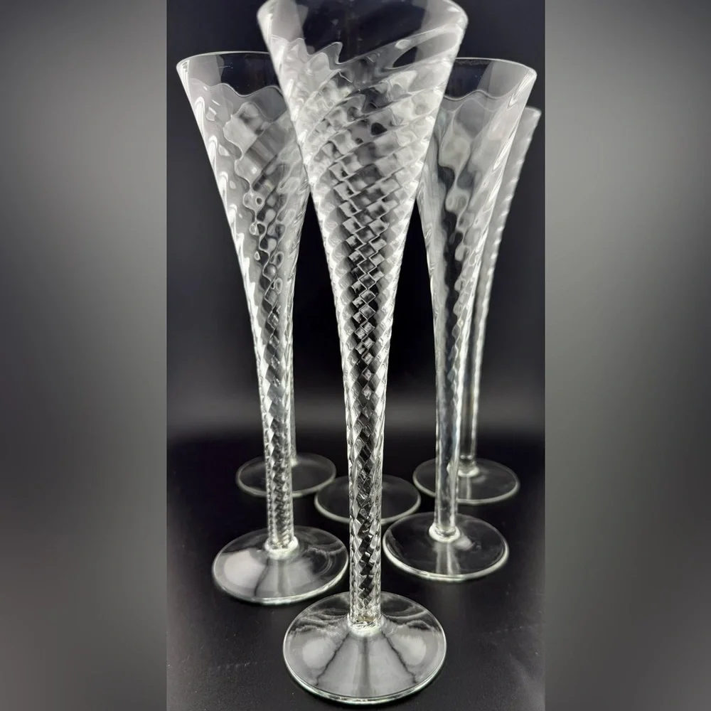 7 Crate & Barrel “Renoir” hollow stemmed champagne flutes. 6oz 10”H